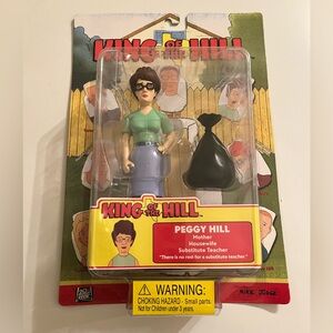 2002 Toycom King Of The Hill action figure features Peggy Hill NIB